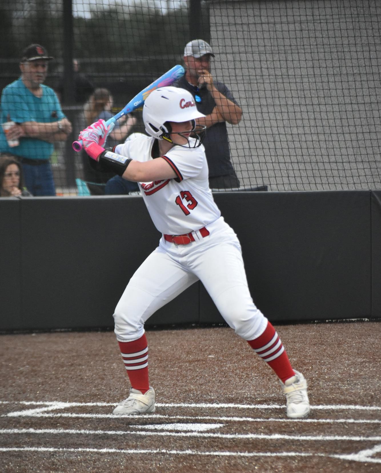 Sophomore Natalie Vaeth loads back into her stance awaiting the pitch. Vaeth finished the night batting 1.000.