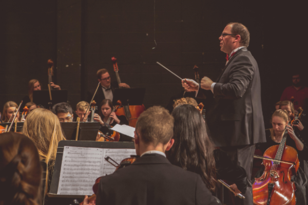 Orchestra teacher Thomas Wright conducts the SHS orchestra during a concert. This was around the beginning of his career at SHS.
Photo contributed by Thomas Wright