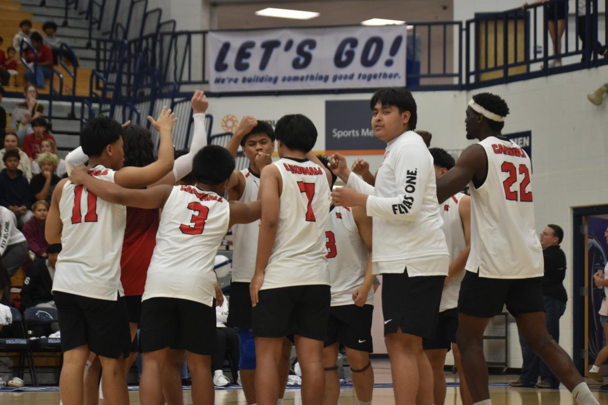 The boys gather together for a pep talk before the game. They encouraged each other and called out their chant.