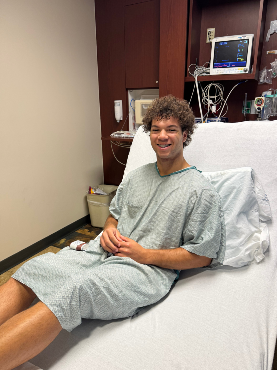 Senior Riley Matlock smiles before he enters surgery. The surgery involved cutting open both of his knees. Photo contributed by Stacey Matlock