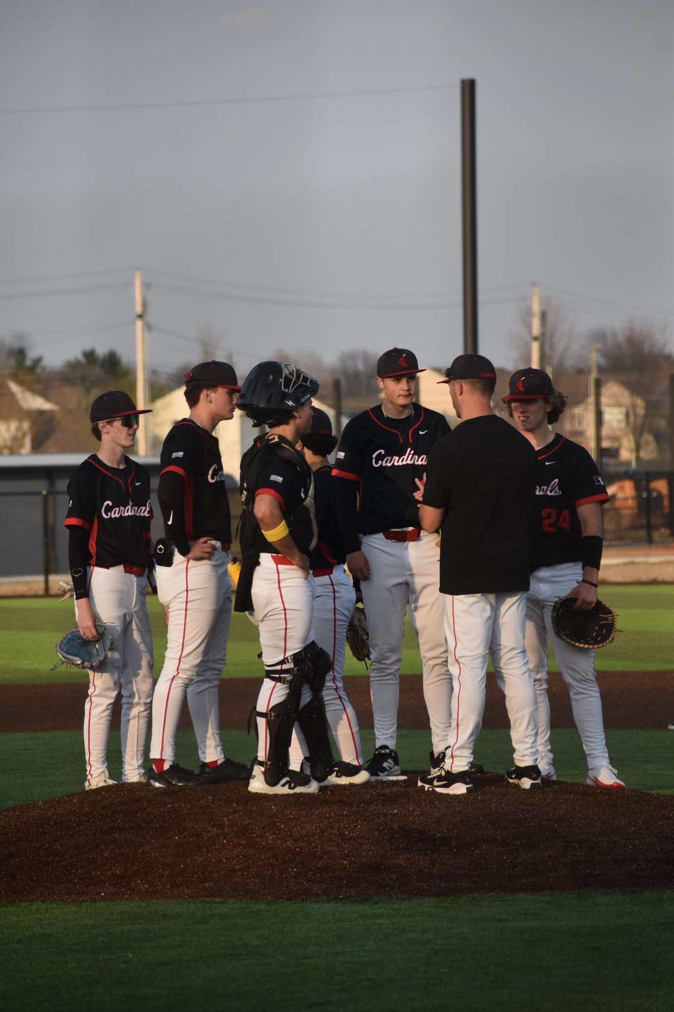 During the fourth inning, head coach Brendan Dudas has a team huddle to regain the focus of his players. This is Dudas 5th year as the baseball coach.