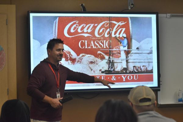 English teacher Brent Bockelman teaches students advertisement skills.  