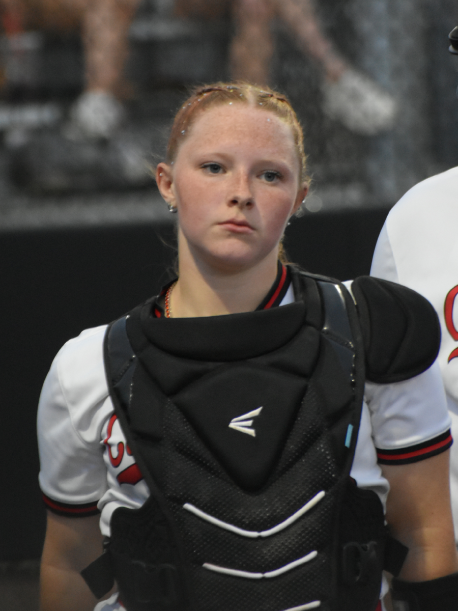 Senior Malia Breedlove walks off the field towards the team huddle on April 17. The Lady Cards won against Perry Meridian, 2-1. 